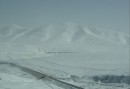 Snow on the mountaintops, seen from the train