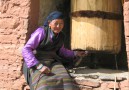 Women at a prayer wheel