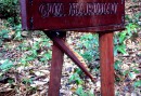 Gua means cave. The sign has been manhandled by elephants